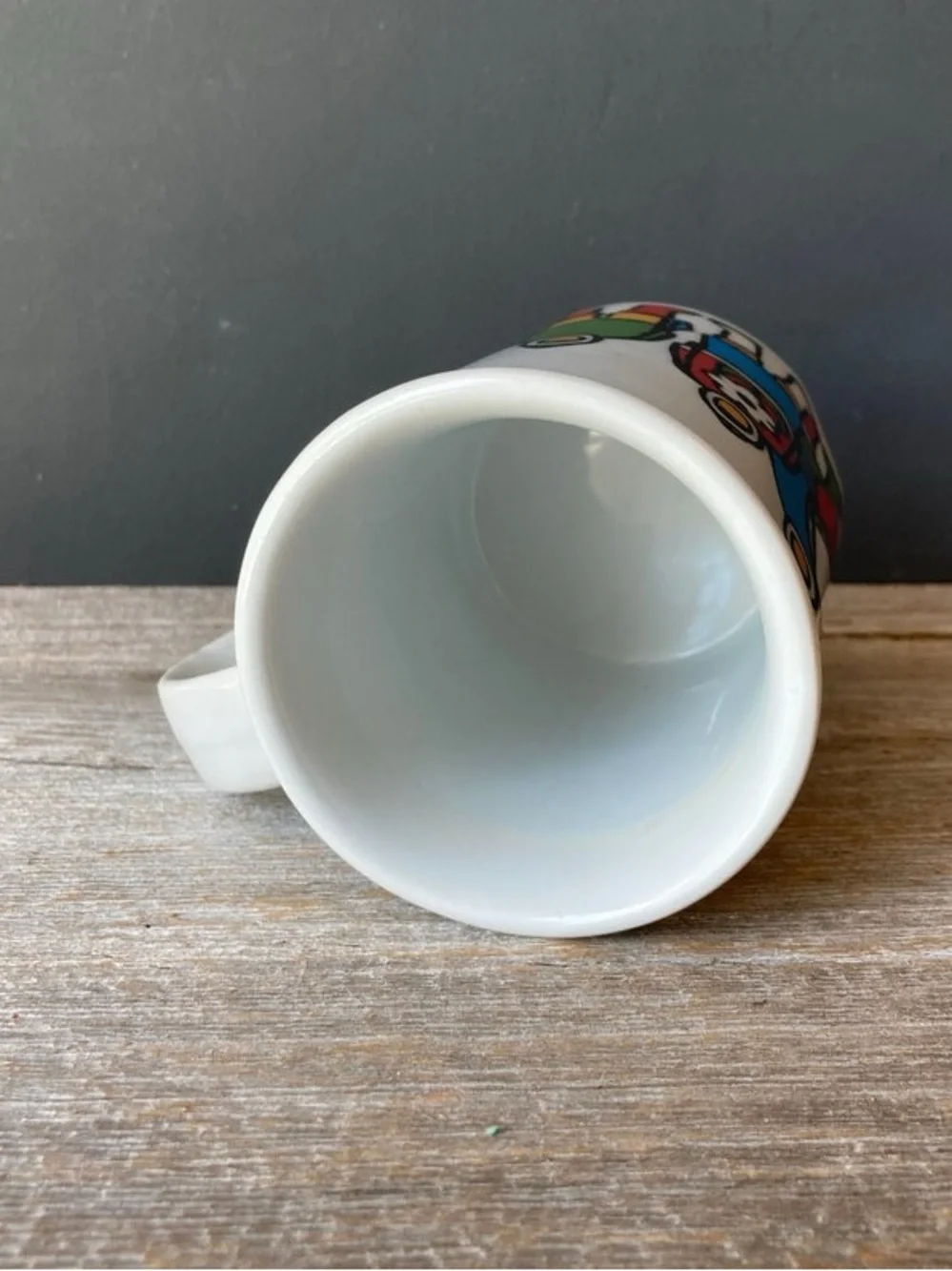 Marc Tetro coffee mug featuring Inuit family artwork by Danesco.
